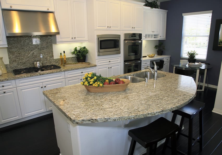 Curved granite kitchen island with undercounter sink