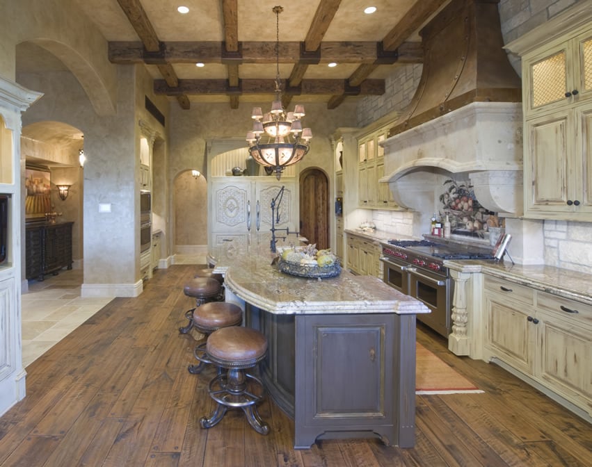 Island with white counter and traditional stools