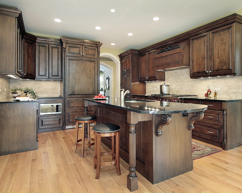 Oval shaped island, built in sink and breakfast bar