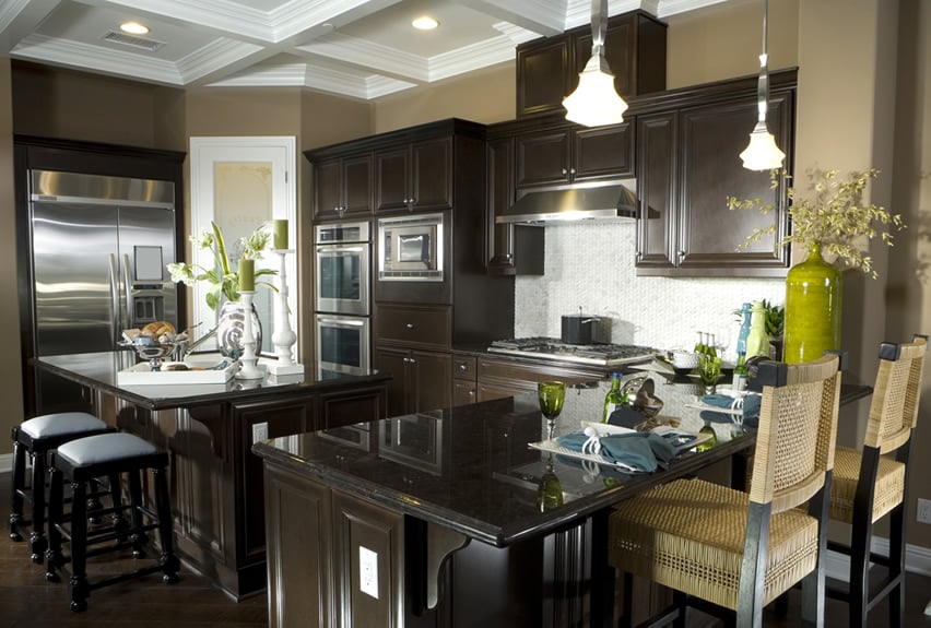Dark kitchen island with eat in dining and bar counter