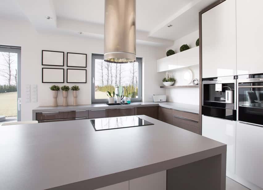 Gray worktable in a modern style with circular stove hood