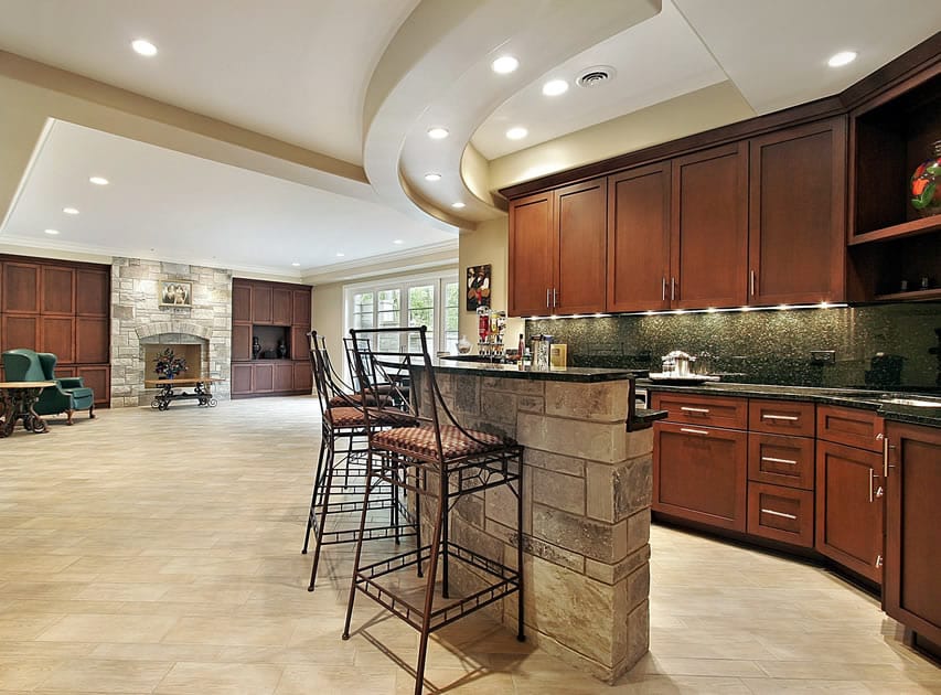 Open space layout with semi circle bar and wood ceramic tiles on the floor