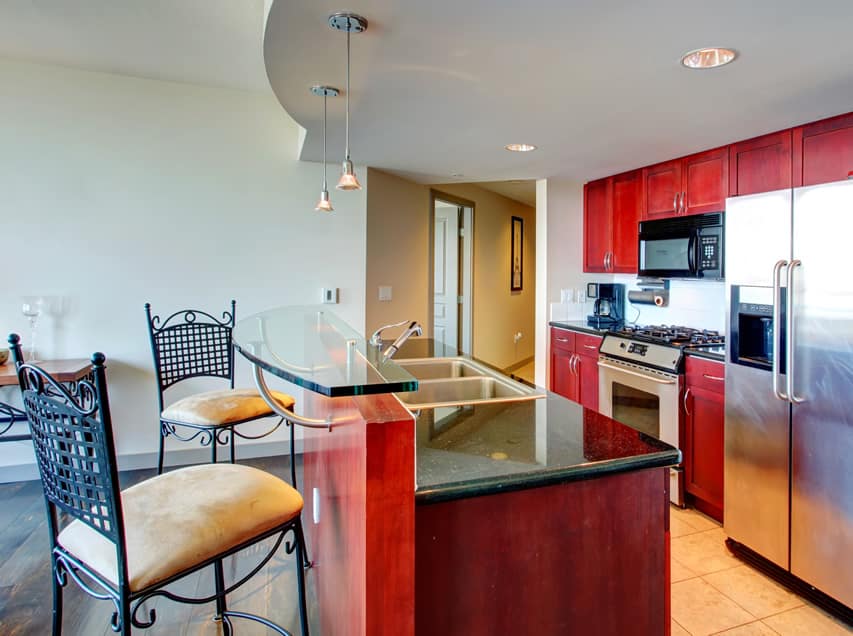 Red cupboards with glass dining counter