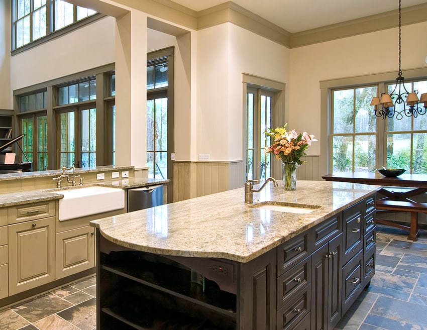 Kitchen with high ceiling and spacious working area with white ceramic sink