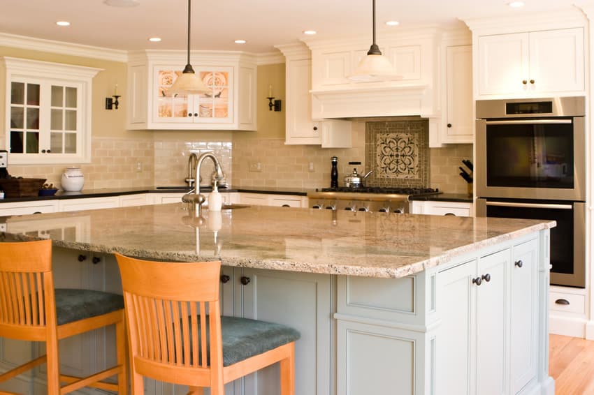 Classic white kitchen cabinets combined with chairs with gray seats