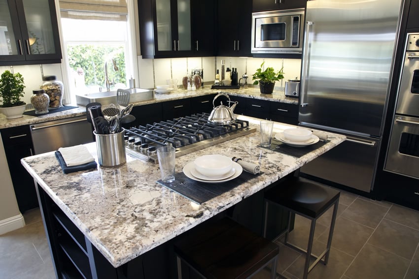 White granite style kitchen island with stove top