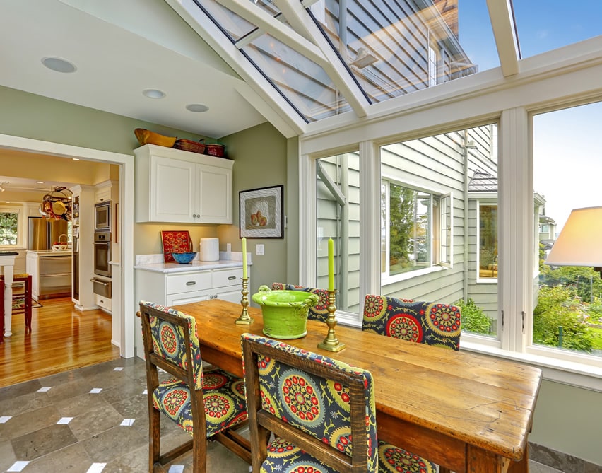 Sun room with dining table and glass ceiling