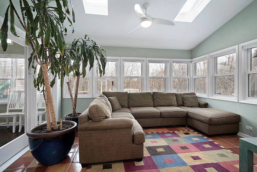 Sunroom with large sectional couch