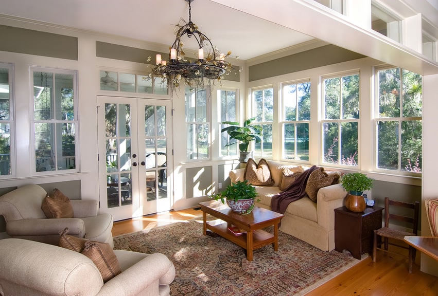 Sunroom with view of patio