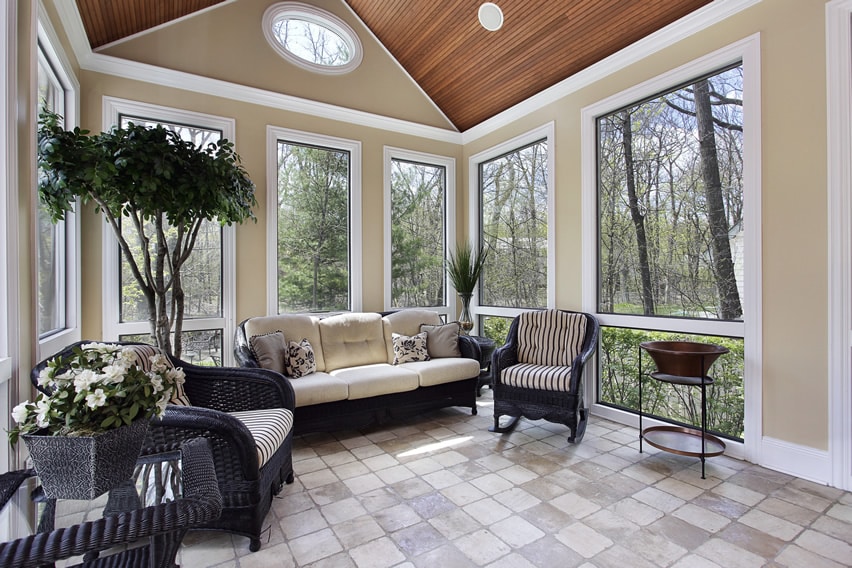 Upscale sunroom with comfy furniture