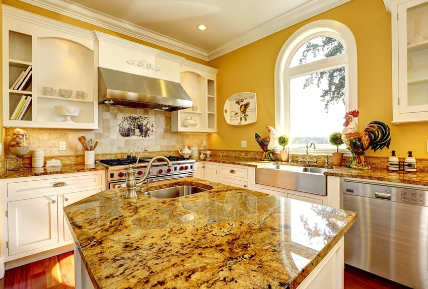White cabinet kitchen island with yellow granite counter