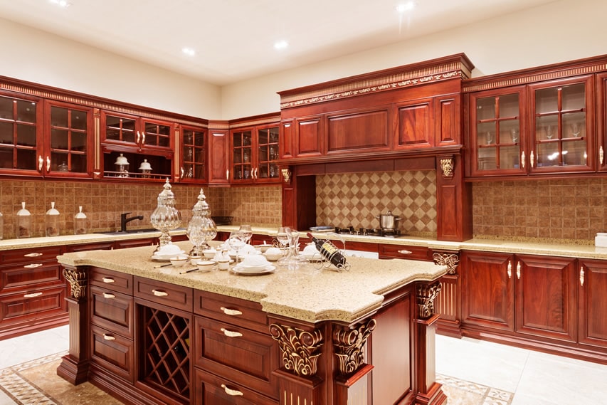 Wood kitchen withmahogany cabinets and gold accents