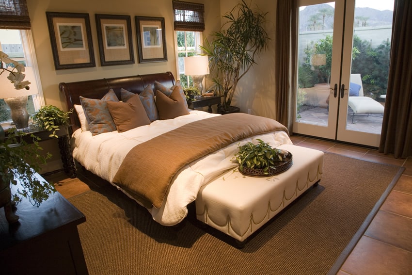 Attractive bedroom with brown colors and white bed bench