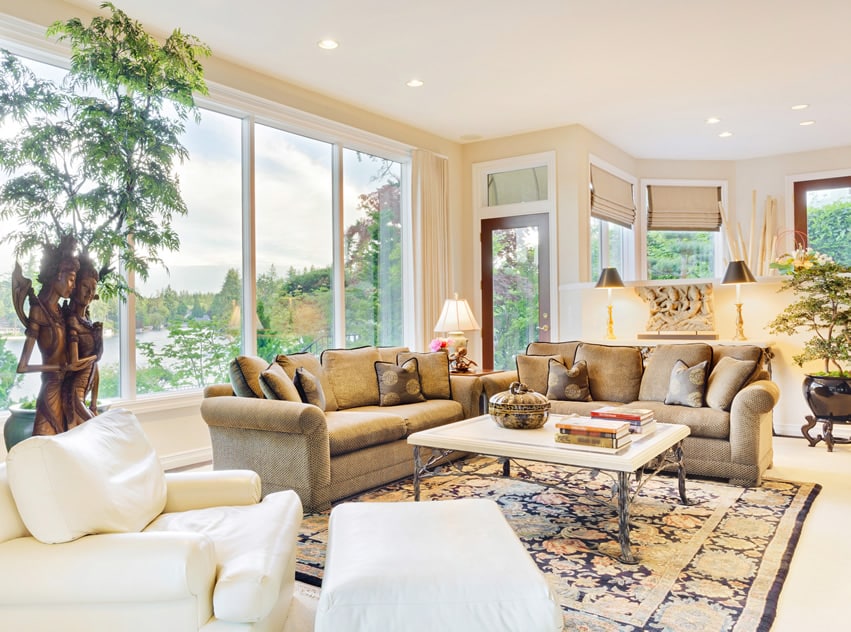 Room with warm brown upholstered sofa and table with iron framing