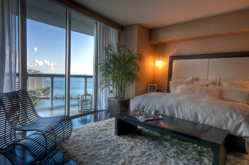 Beautiful penthouse retreat bedroom with water views