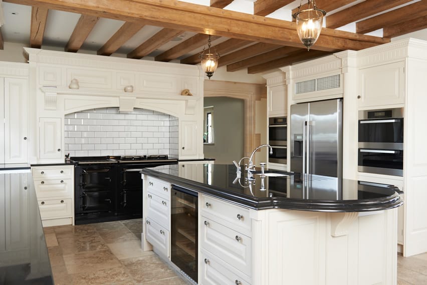 Beautiful u shaped kitchen with exposed beams