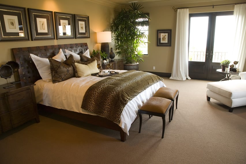 Designer bedroom retreat with sitting area and luxury decor
