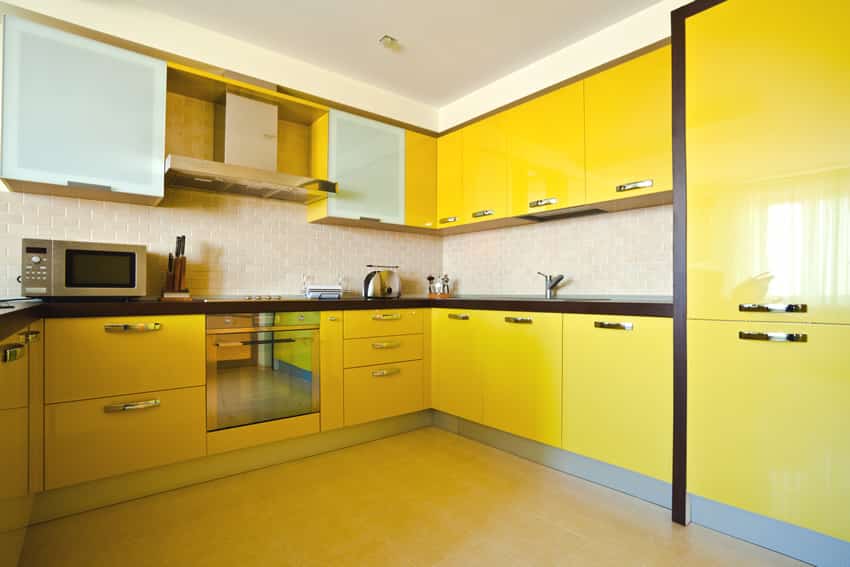 Bright yellow modern kitchen with black counters