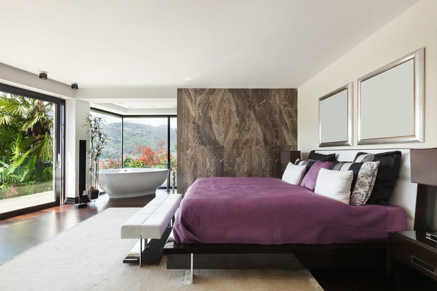 Calm seclusion bedroom with expansive view and freestanding bathtub