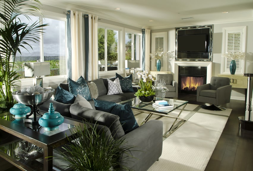 Room with comfy couches with blue accent pillows 