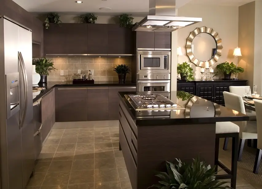 Contemporary kitchen with dark brown cabinets and black counter