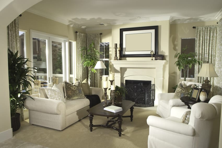 White washed room accentuated by dark stained table with curvy edges