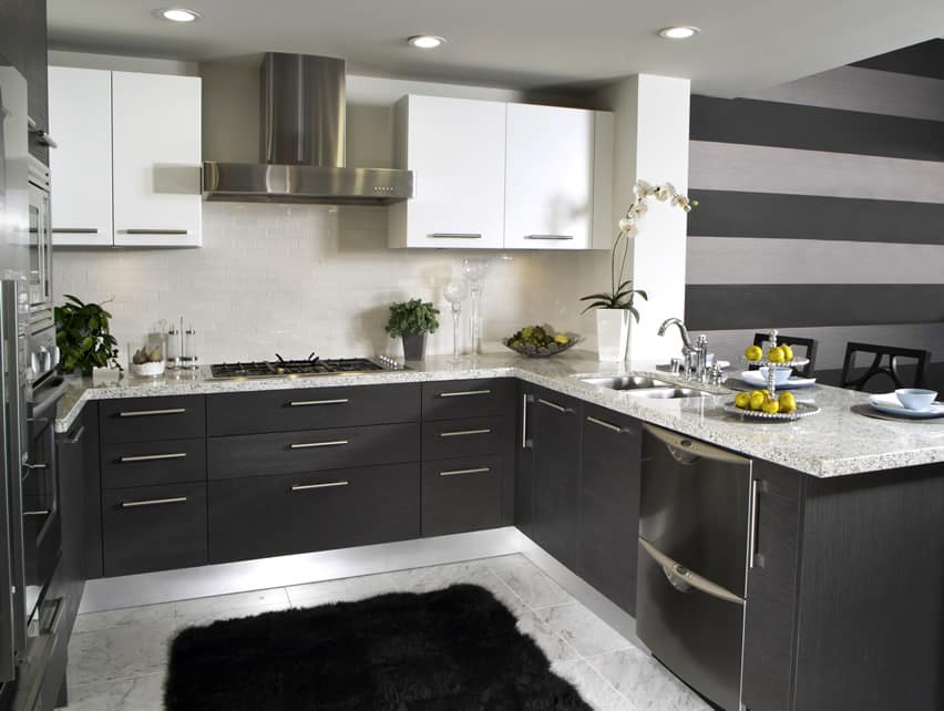 Dark u-shaped kitchen with subway tile backsplash