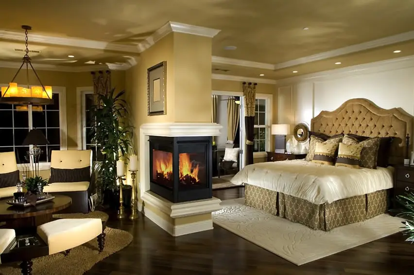 Master bedroom with center fireplace and separate sitting areas