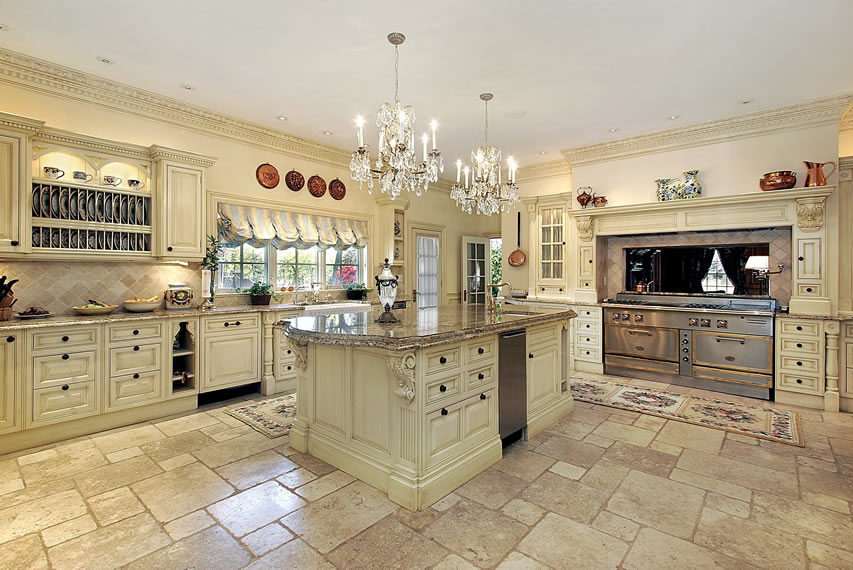 Kitchen with travertine floors and crystal chandeliers