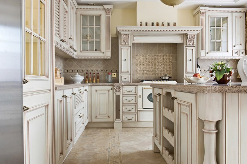 Kitchen island with wine rack and painted in antique white finish