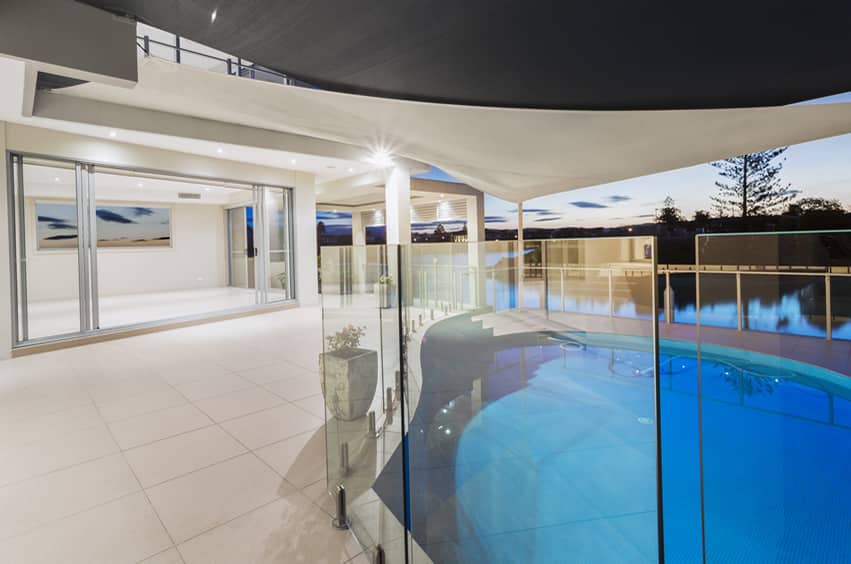 Glass enclosed swimming pool overlooking river