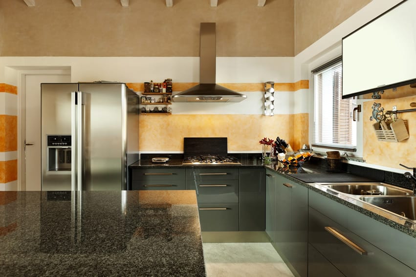 Gloss green cabinet and kitchen with granite counters