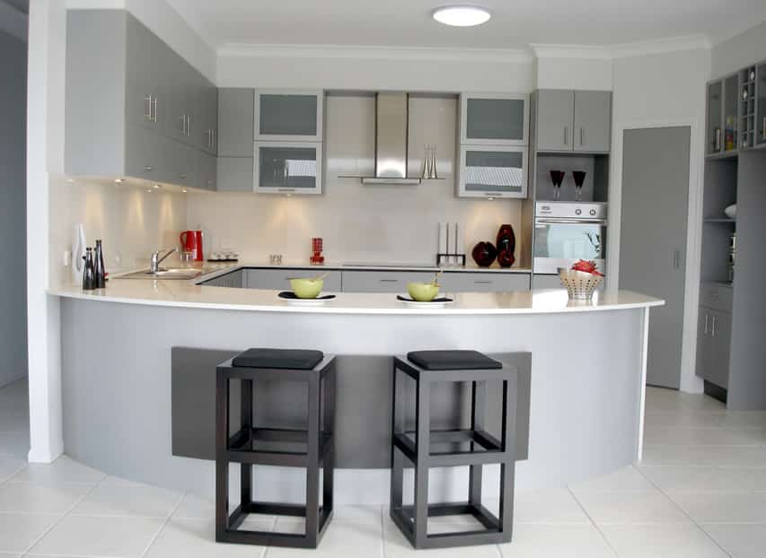 Gray u-shaped kitchen with eat in bar