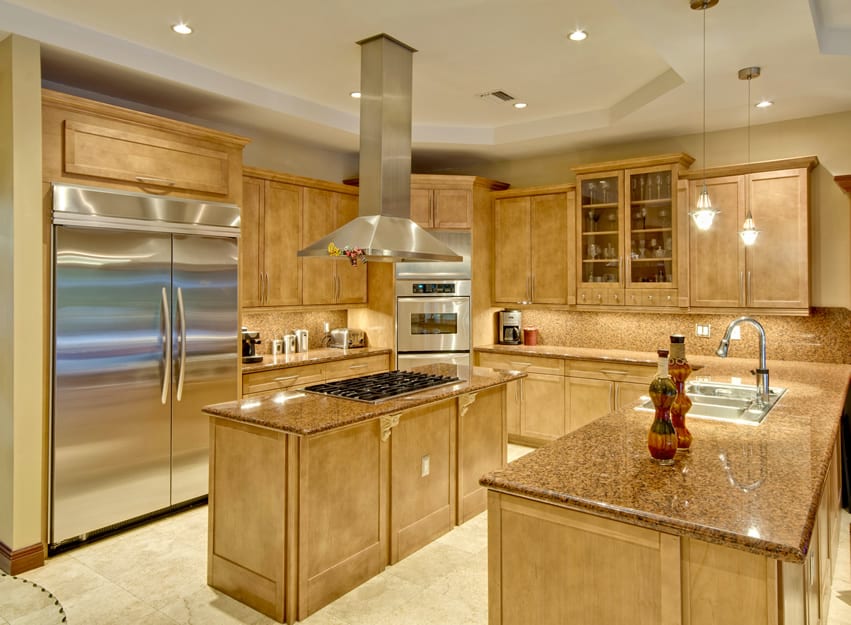 High end kitchen with granite and light wood cupboards