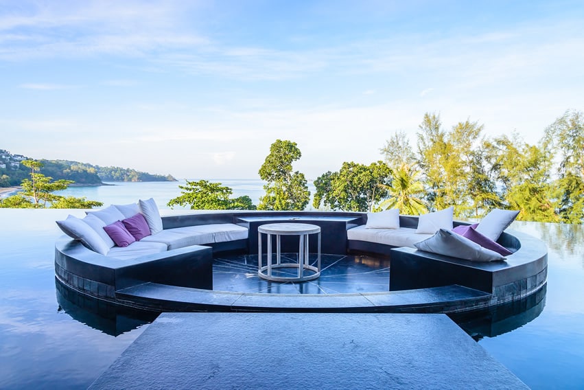 Large infinity pool with lounge sitting area