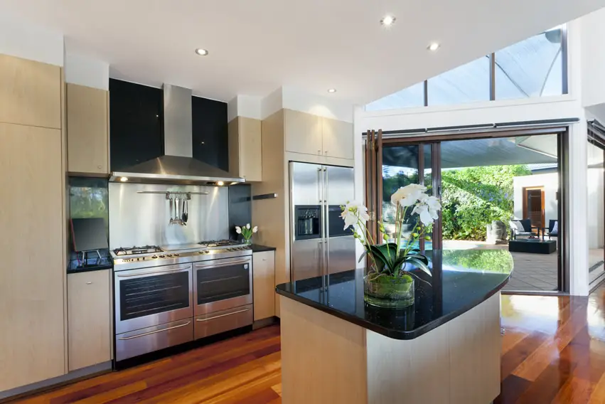 Light tan modern kitchen design with hardwood floors