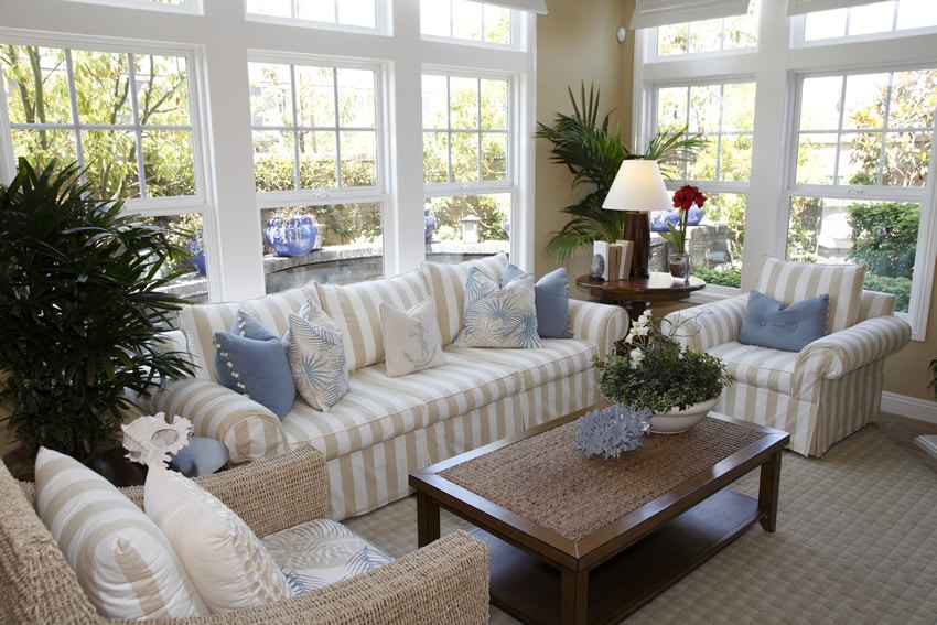 Room with framed windows and striped furniture