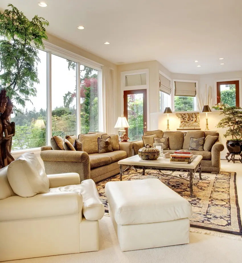 Living room with tan couches and white leather chair