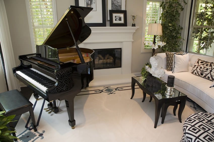 Living room with white theme baby grand piano