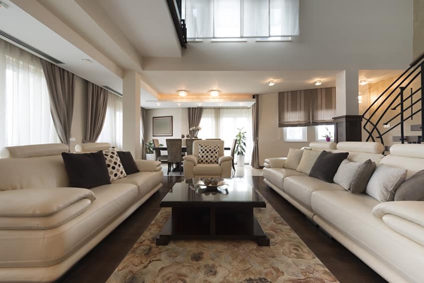 Luxury living room with large cream leather couches
