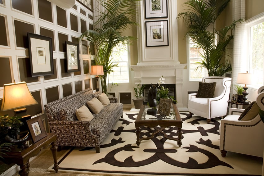 Room with paneled wall and sofa with patterned design 