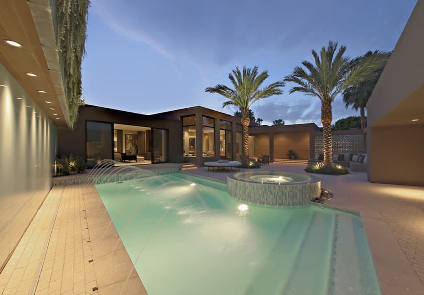 Luxury pool with water feature fountains and hot tub