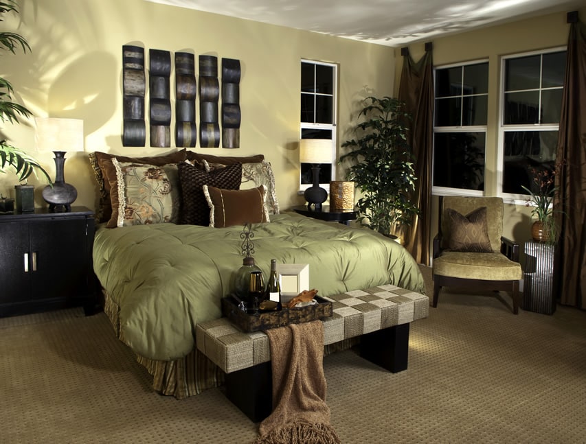 Master bedroom with brown color accents and wood wall art