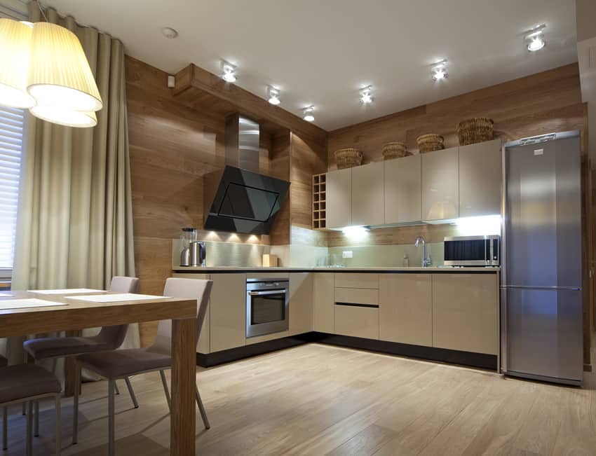 Kitchen with golden walnut walls and bleached oak floors