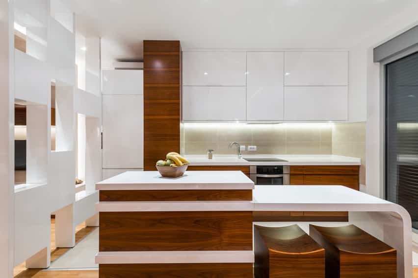 Kitchen with modular cabinets, lighting and island base made of pecan wood