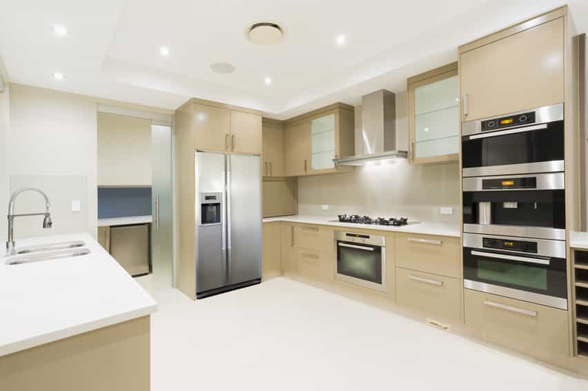 Kitchen with tan cabinets and flush lighting