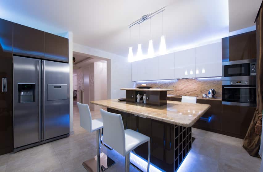 Modern kitchen with large island and floor lighting