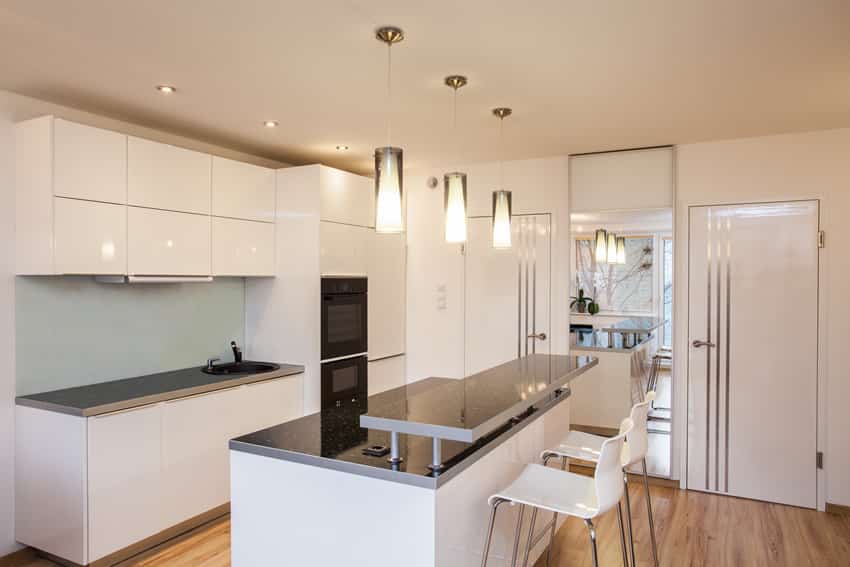 Sleek white modern kitchen with gray two level counter