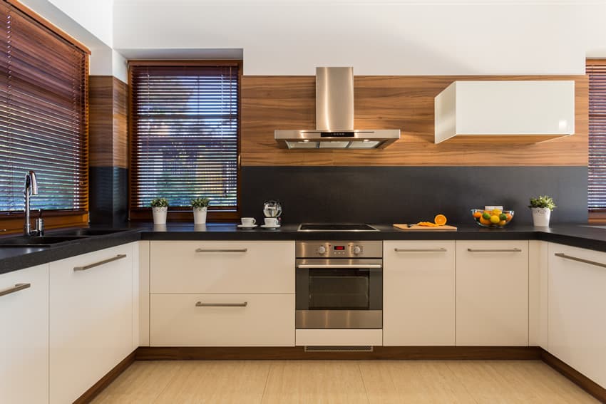 Stylish u-shaped kitchen white cabinets black counter