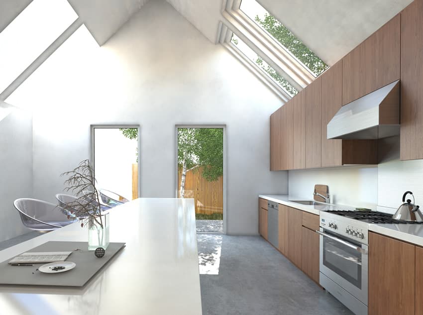 Kitchen with cathedral ceiling, skylights and solid surface counters